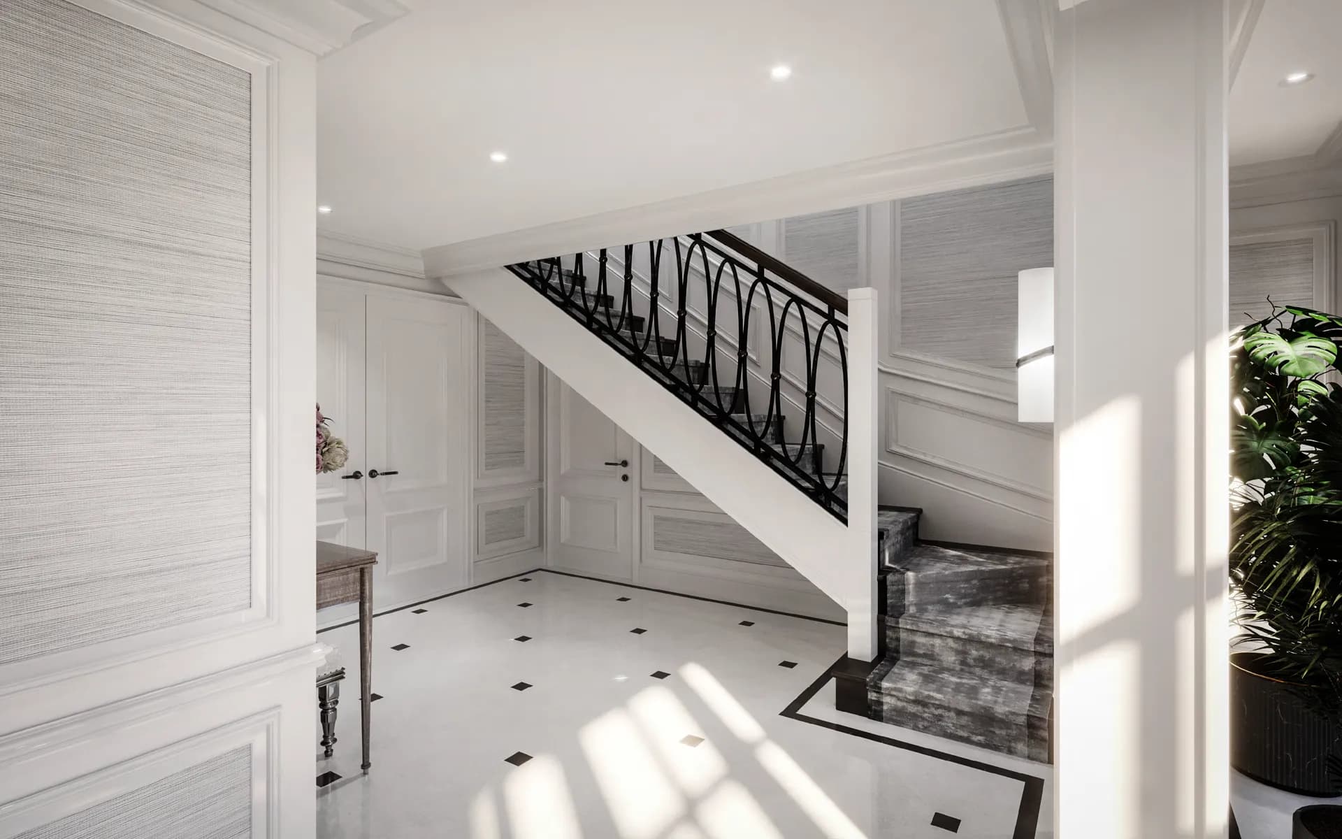 Staircase with a curved iron balustrade in a white panelled hall — House at Albert Mews, Romford