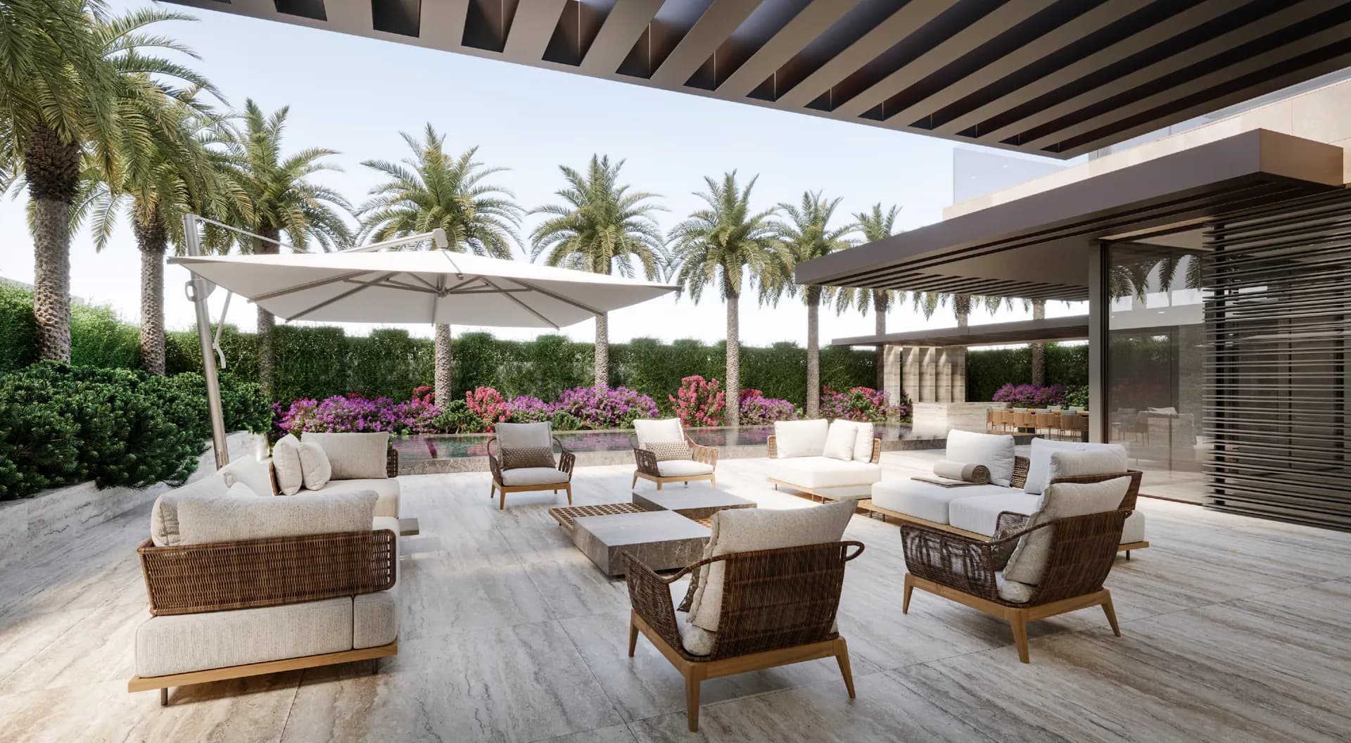 Covered outdoor lounge with rattan armchairs, parasols and palms — Villa Nudra, Saadiyat Island